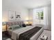 Serene bedroom with natural light, stylish bedding, and minimalist decor provides a peaceful retreat at 11548 Helmond Way # 104, Raleigh, NC 27617