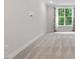 Neutral bedroom with carpet, window, and simple decor, offering a calming and spacious atmosphere at 11548 Helmond Way # 104, Raleigh, NC 27617