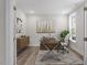 Cozy office space featuring modern desk, stylish rug, and a large window for natural light, creating a productive atmosphere at 11548 Helmond Way # 104, Raleigh, NC 27617