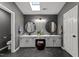 A spacious bathroom features dual sinks, a walk in toilet, and gray walls at 120 E Laurenbrook Ct, Cary, NC 27518