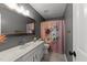 Cozy bathroom with a floral shower curtain and a white vanity at 120 E Laurenbrook Ct, Cary, NC 27518