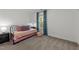 Bedroom with neutral walls, carpet, a window, and basic furniture at 120 E Laurenbrook Ct, Cary, NC 27518