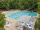 Community pool featuring many chairs, tables, and a pergola at 120 E Laurenbrook Ct, Cary, NC 27518