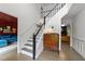 Bright foyer with staircase, wood floors, and vintage decor at 120 E Laurenbrook Ct, Cary, NC 27518