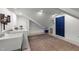 Bright laundry room with washer, sink, blue door, and updated flooring at 120 E Laurenbrook Ct, Cary, NC 27518