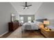 The main bedroom is spacious and has natural light, a mirror, and is carpeted at 120 E Laurenbrook Ct, Cary, NC 27518