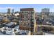 Aerial view of a modern building, showcasing its architecture and surrounding cityscape on a sunny day at 122 N Harrington St # 1025, Raleigh, NC 27603