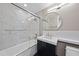 Modern bathroom features a shower-tub combination with marble tile and a sleek vanity at 122 N Harrington St # 1025, Raleigh, NC 27603