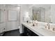Modern bathroom with double vanity, sleek fixtures, elegant mirrors, and beautiful tile work at 122 N Harrington St # 1025, Raleigh, NC 27603