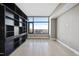 Empty bedroom with a large window providing abundant natural light and city views at 122 N Harrington St # 1025, Raleigh, NC 27603