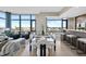 Elegant dining area featuring a glass table, modern chairs, and stunning city views at 122 N Harrington St # 1025, Raleigh, NC 27603