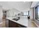 Gourmet kitchen featuring custom cabinetry, a marble countertop, and a stainless steel dishwasher at 122 N Harrington St # 1025, Raleigh, NC 27603