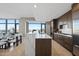 Spacious kitchen features a breakfast bar, dark cabinetry, and city views at 122 N Harrington St # 1025, Raleigh, NC 27603