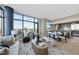 Open-concept living space boasts large windows, a modern design, and a bright, airy atmosphere at 122 N Harrington St # 1025, Raleigh, NC 27603