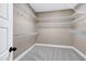 Walk-in closet with wire shelving and carpet at 129 Middlegreen Pl, Holly Springs, NC 27540