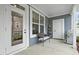 Cozy back porch featuring a cushioned seat, an outdoor grill, and a view of the community at 1313 Littlehills Dr, Apex, NC 27523