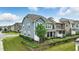 Exterior view of a two-story home, showcasing its fenced yard and well-maintained landscaping at 1313 Littlehills Dr, Apex, NC 27523