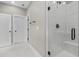 Bathroom featuring a modern shower with sleek fixtures and a white marble surround at 1313 Littlehills Dr, Apex, NC 27523