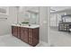 Bathroom featuring a large vanity with double sinks and a view into the adjoining bedroom at 1313 Littlehills Dr, Apex, NC 27523