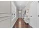 Inviting entryway featuring hardwood floors, white trim, and ample natural light from windows at 1313 Littlehills Dr, Apex, NC 27523