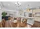 Open-concept kitchen with granite countertops, stainless steel appliances, and hardwood floors at 1313 Littlehills Dr, Apex, NC 27523