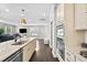 Modern kitchen featuring granite countertops, stainless steel appliances, and an open design at 1313 Littlehills Dr, Apex, NC 27523