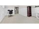 Home office features a desk with monitors, wainscotting, and a view into a hallway at 1313 Littlehills Dr, Apex, NC 27523