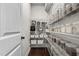 Organized walk-in pantry with shelving, offering ample storage for food and kitchen essentials at 1313 Littlehills Dr, Apex, NC 27523
