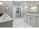 Elegant bathroom with marble flooring, a glass shower, and white cabinets with gold fixtures at 135 Gary Rd, Carrboro, NC 27510