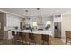 Bright, spacious kitchen featuring a center island, stainless steel appliances, and modern lighting fixtures at 135 Gary Rd, Carrboro, NC 27510