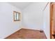 Bedroom featuring light walls, a window with outdoor views and a built in closet at 1409 Valley, Durham, NC 27707