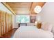 Cozy bedroom with light wood ceiling, built in closets and large window offering outdoor views at 1409 Valley, Durham, NC 27707