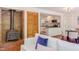 Comfortable living room featuring a cozy fireplace and seamless flow to the kitchen at 1409 Valley, Durham, NC 27707