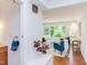 Bright living room featuring brick floors, modern furniture, and a wall of windows with lush outdoor views at 1409 Valley, Durham, NC 27707