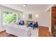 Cozy living room with large windows, stylish decor, and brick floors at 1409 Valley, Durham, NC 27707