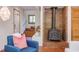 Bright living room with wood-burning stove fireplace and easy access to the stairwell at 1409 Valley, Durham, NC 27707