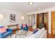 Living room featuring a brick fireplace, wood-burning stove, and bright, airy atmosphere at 1409 Valley, Durham, NC 27707