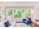 Bright and airy living room with a view of the green foliage and surrounding outdoor space at 1409 Valley, Durham, NC 27707