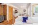 Inviting living room with fireplace and brick flooring, adjacent to a modern kitchen at 1409 Valley, Durham, NC 27707