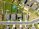 An aerial view of a neighborhood with fenced yards, pools, playgrounds, and well-maintained landscaping at 1561 Dorsett Ln, Creedmoor, NC 27522
