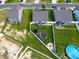 An aerial view of a backyard with a patio, playground, and well-manicured lawn at 1561 Dorsett Ln, Creedmoor, NC 27522