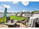 Large, Gathering-friendly backyard with a trampoline, playset, manicured lawn, and a patio set at 1561 Dorsett Ln, Creedmoor, NC 27522