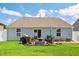 Spacious backyard featuring a patio with outdoor seating, a fire pit, and a well-maintained lawn at 1561 Dorsett Ln, Creedmoor, NC 27522