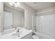 Bright bathroom featuring a large vanity, ample mirror space, and a shower-tub combination at 1561 Dorsett Ln, Creedmoor, NC 27522