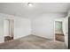 Spacious bedroom featuring neutral carpet and convenient access to adjoining rooms at 1561 Dorsett Ln, Creedmoor, NC 27522