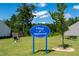 Community sign for Village at Applewood with benches and landscaping at 1561 Dorsett Ln, Creedmoor, NC 27522