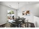 Bright dining area with a large table, chairs, and sliding door to backyard at 1561 Dorsett Ln, Creedmoor, NC 27522