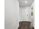 Bright hallway features wood floors, white walls, and a front door at 1561 Dorsett Ln, Creedmoor, NC 27522