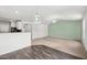 Open-concept kitchen and living room with great natural light and modern fixtures at 1561 Dorsett Ln, Creedmoor, NC 27522