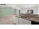 Open kitchen features granite countertops, stainless sink and backyard views at 1561 Dorsett Ln, Creedmoor, NC 27522